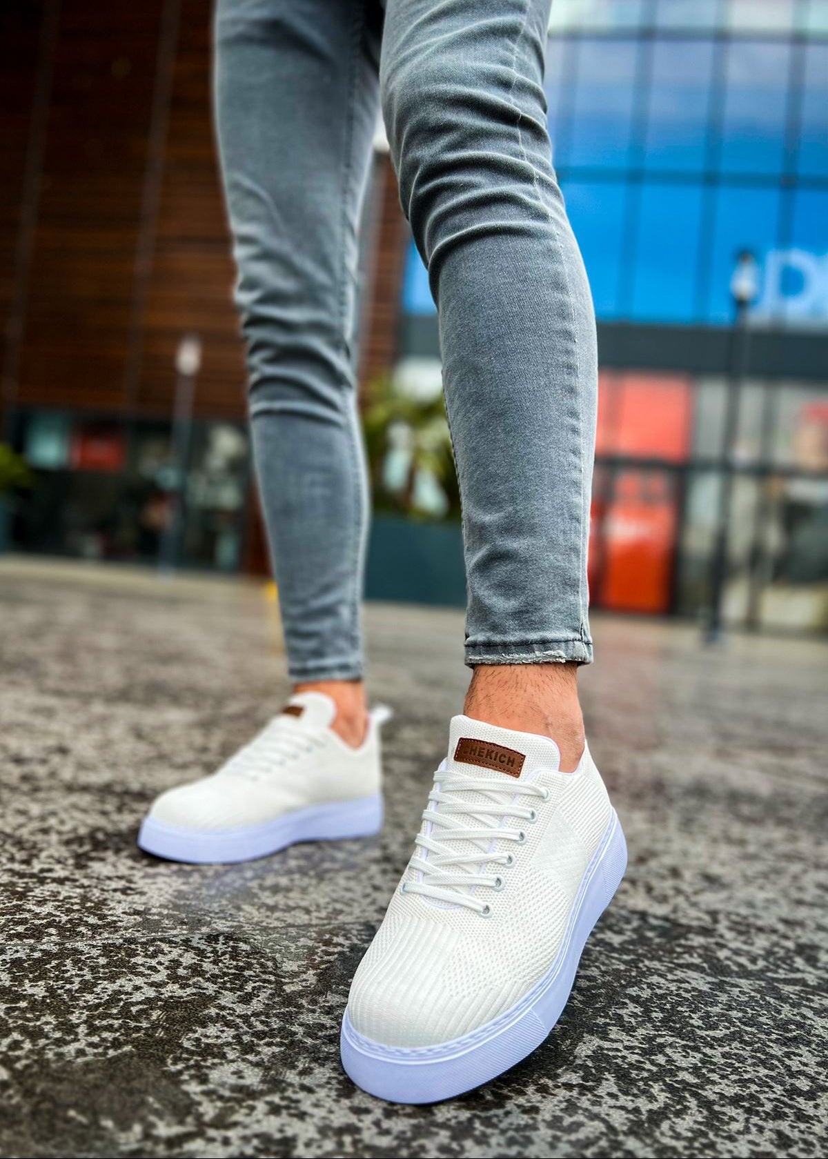 Kotor Pure Serenity knit sneaker in white by Apollo Moda, worn with light grey jeans