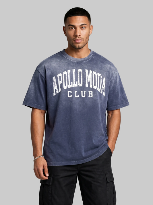 Man wearing a blue t-shirt with 'Apollo Moda Club' text on a gray background