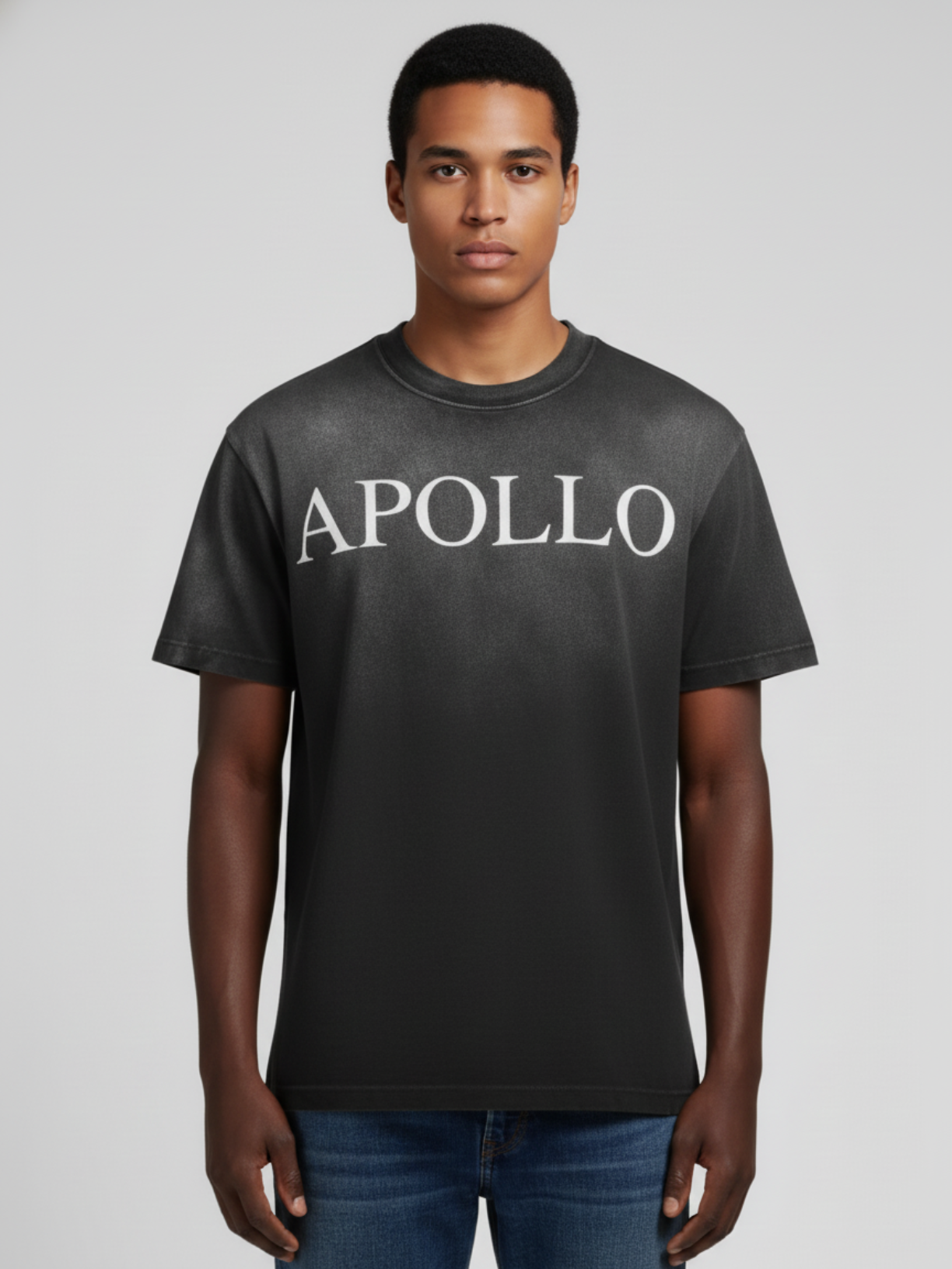 Man wearing a black t-shirt with 'APOLLO' text on a plain background