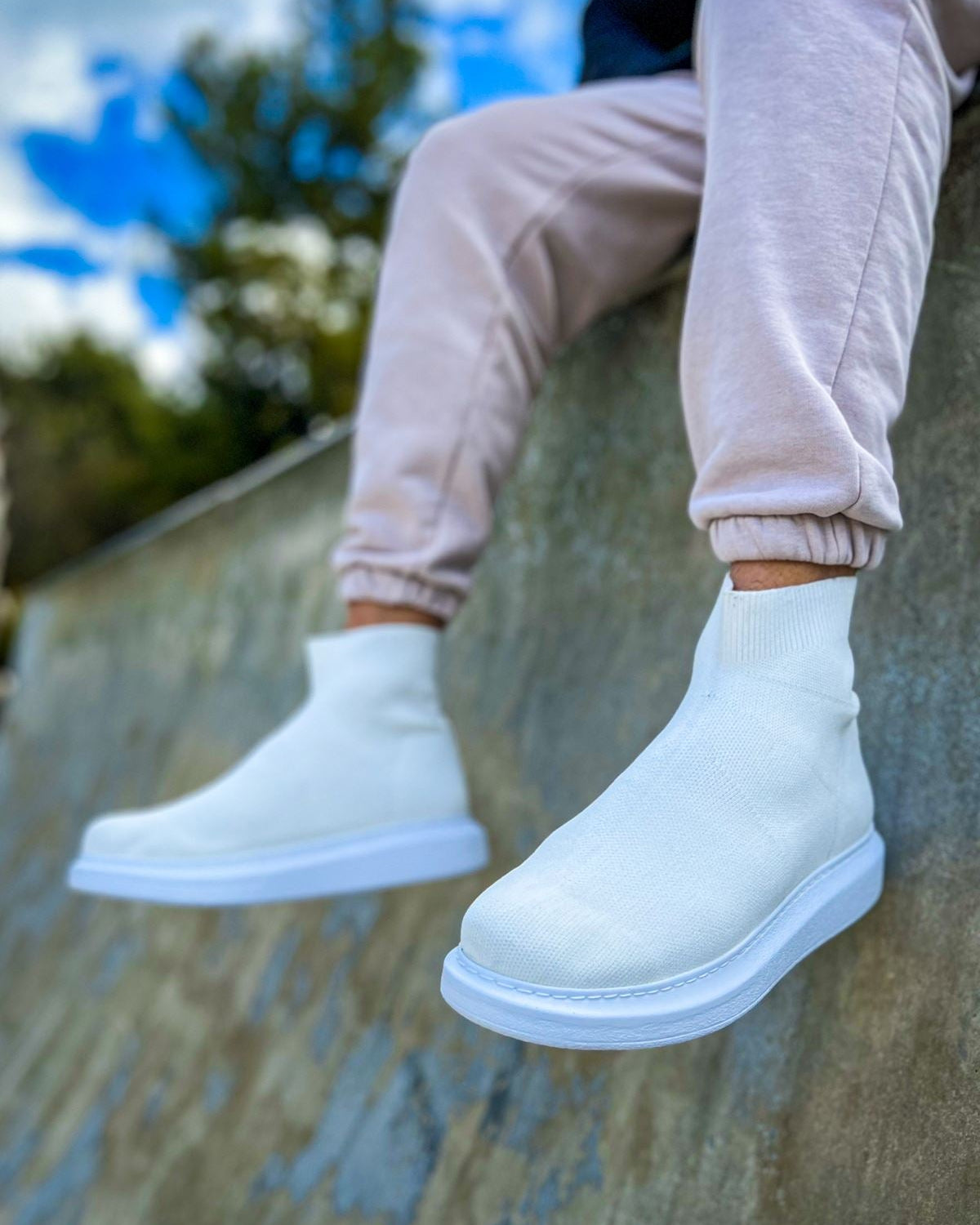 A pair of men's Torino X White ankle mesh boots material and white height-enhancing soles.