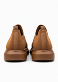 Back shot of a pair of brown knit Torino sneakers featuring a lightweight sole and breathable fabric upper.
