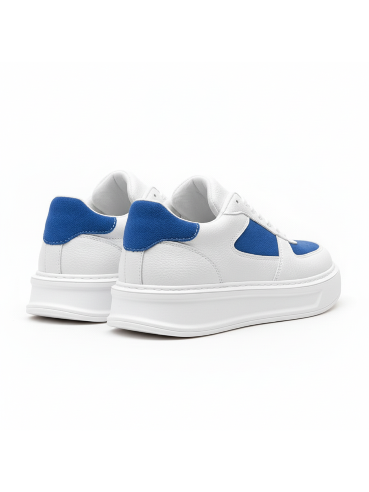 White sneakers with blue accents on a white background