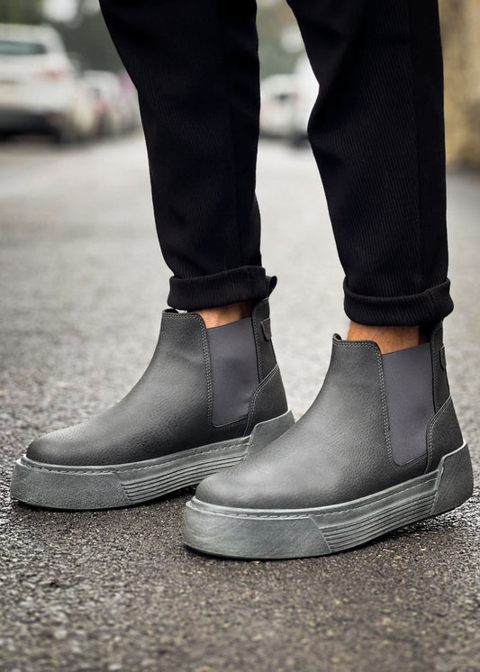 Close-up of Avalon Noir Essence charcoal Chelsea Apollo boots with matte gray sole.