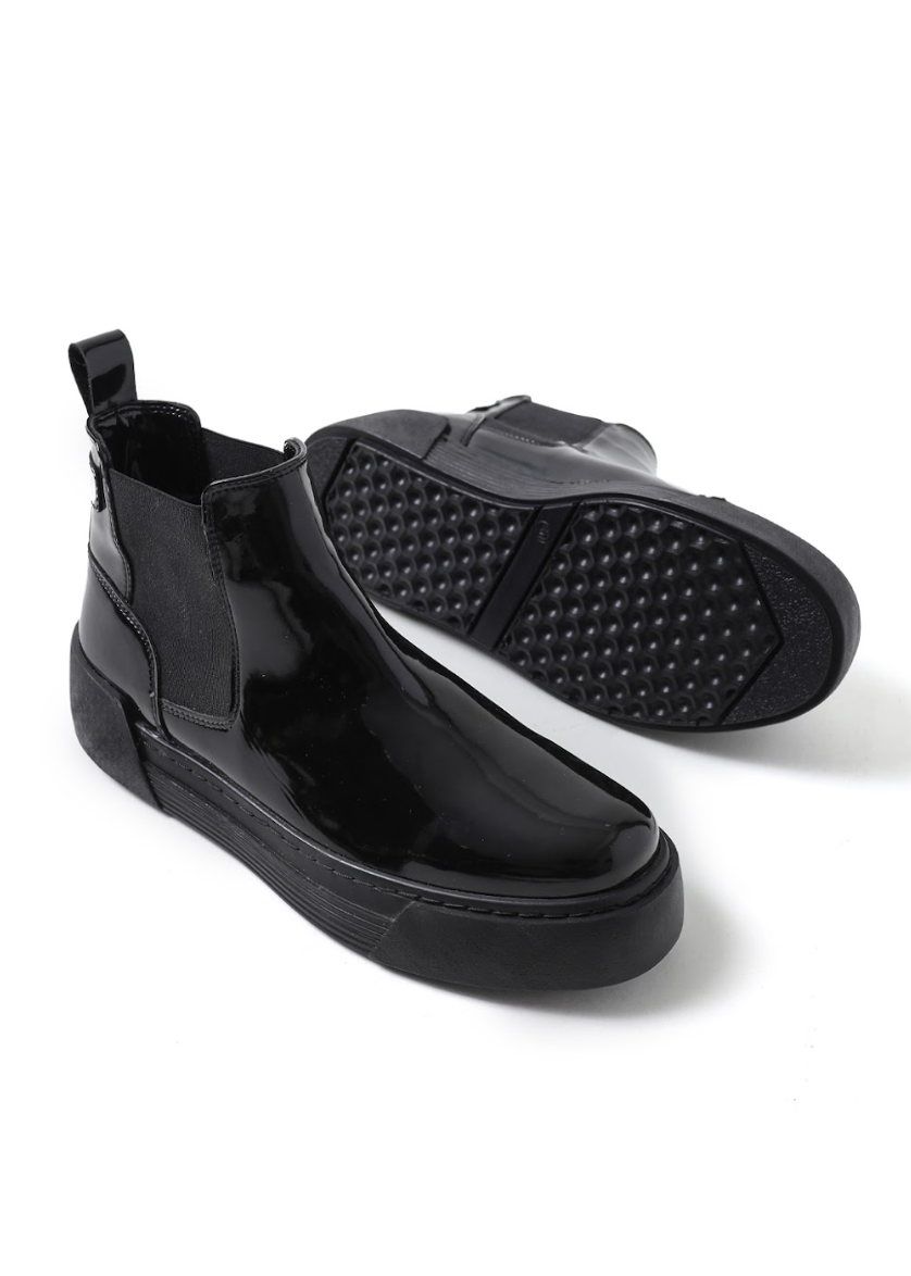 Side profile of black patent Avalon Chelsea Apollo boots with cushioned platform sole.