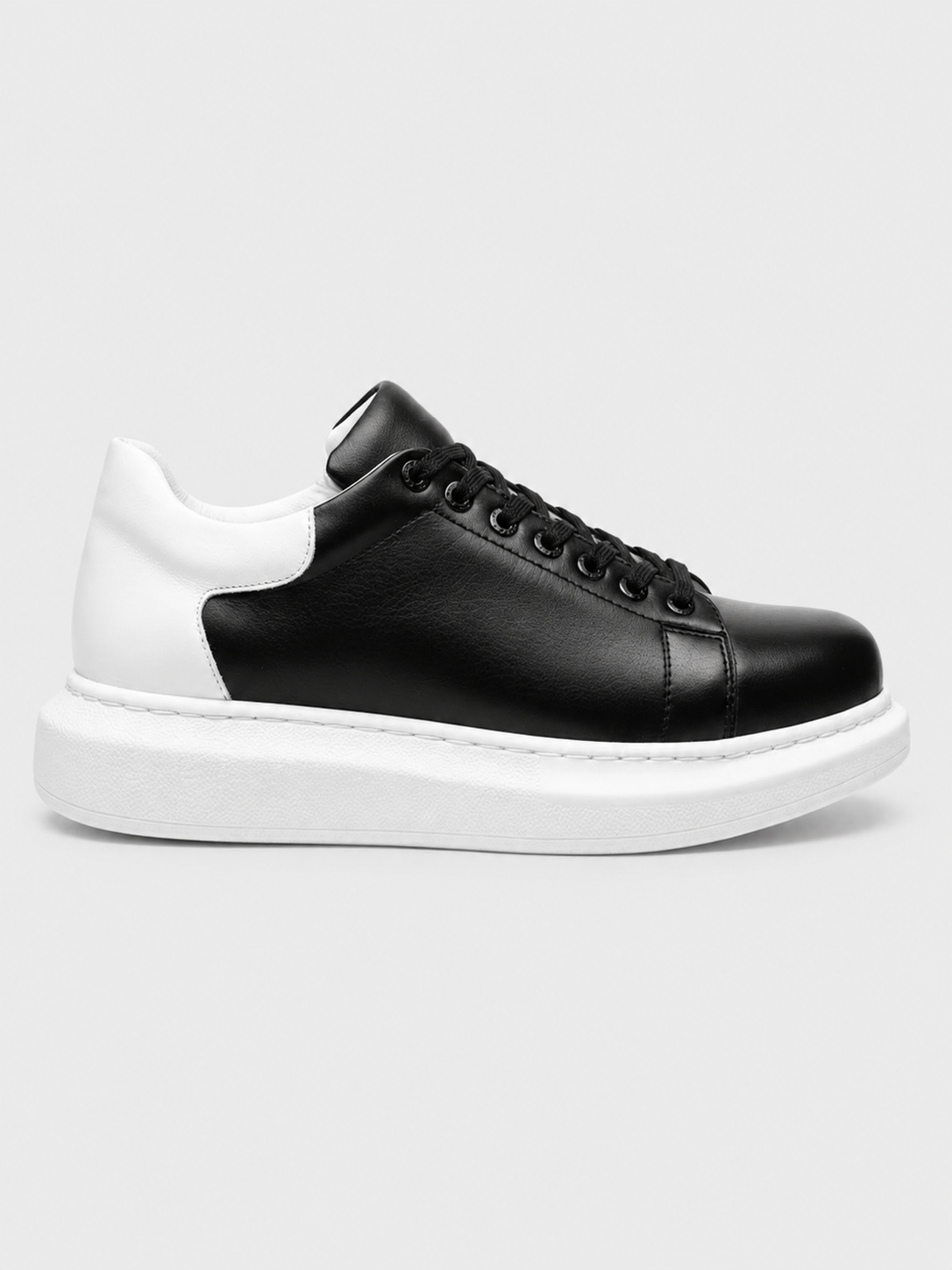 Pluto X low-top casual sneaker in black and white by Apollo Moda