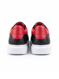 Men's Pluto Noir by Apollo Moda, black leather low-top sneaker with red accents, third angle